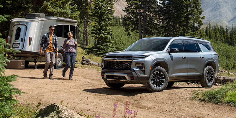 A Chevrolet Traverse parked in the mountains, showcasing its rugged design against a scenic backdrop in Valencia, CA.